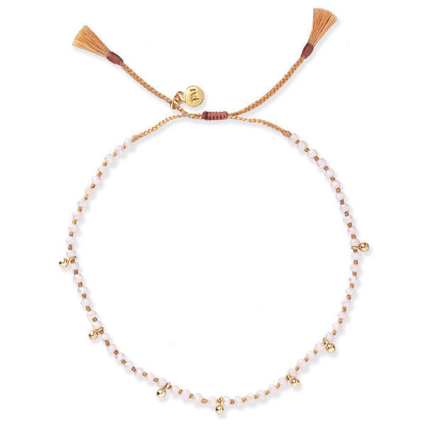 Tai Knot white cream AB opaque faceted beads with mini gold round charms slide closure bracelet